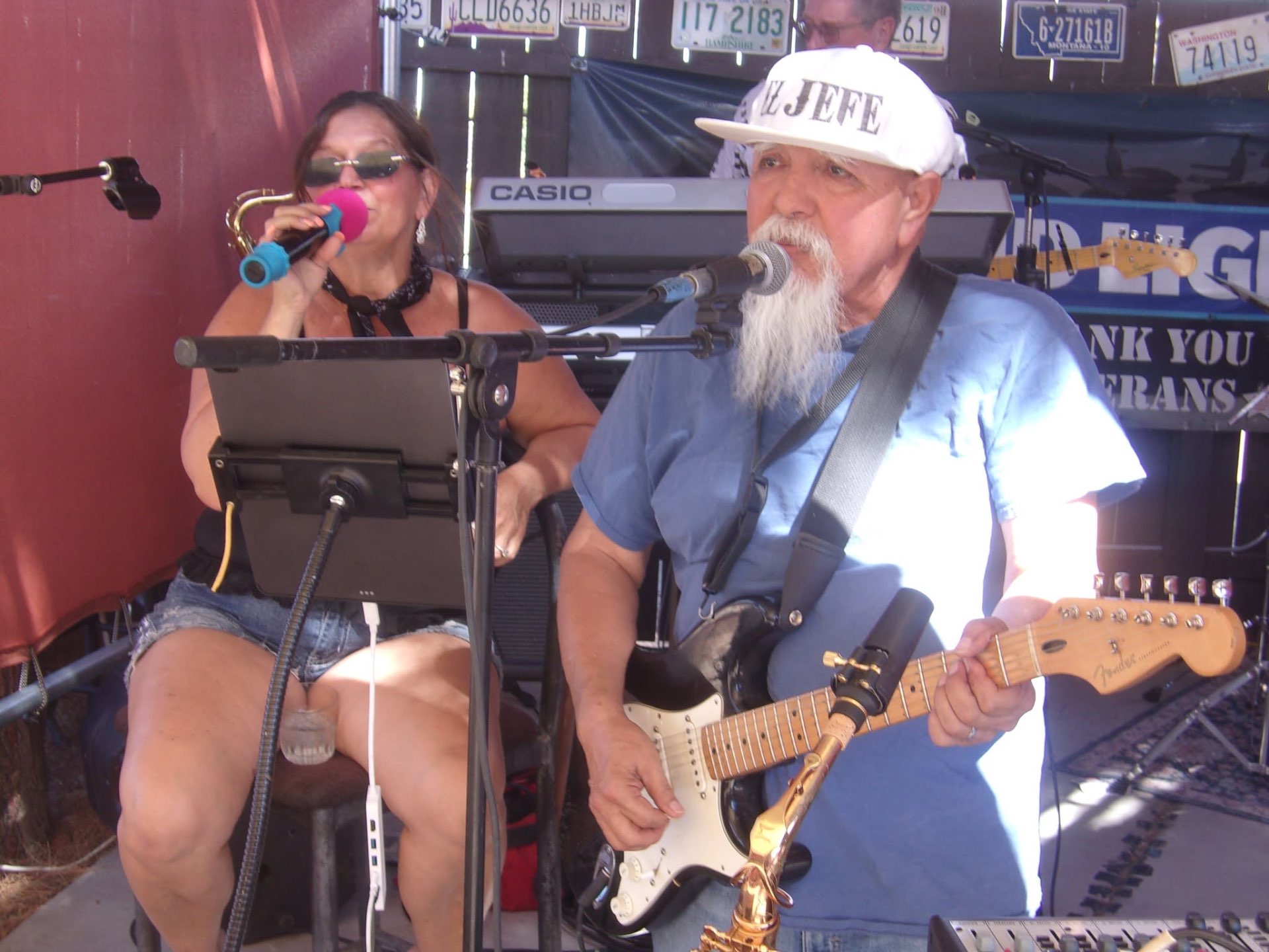 Laurie singing while Raul plays guitar during an outdoor live set