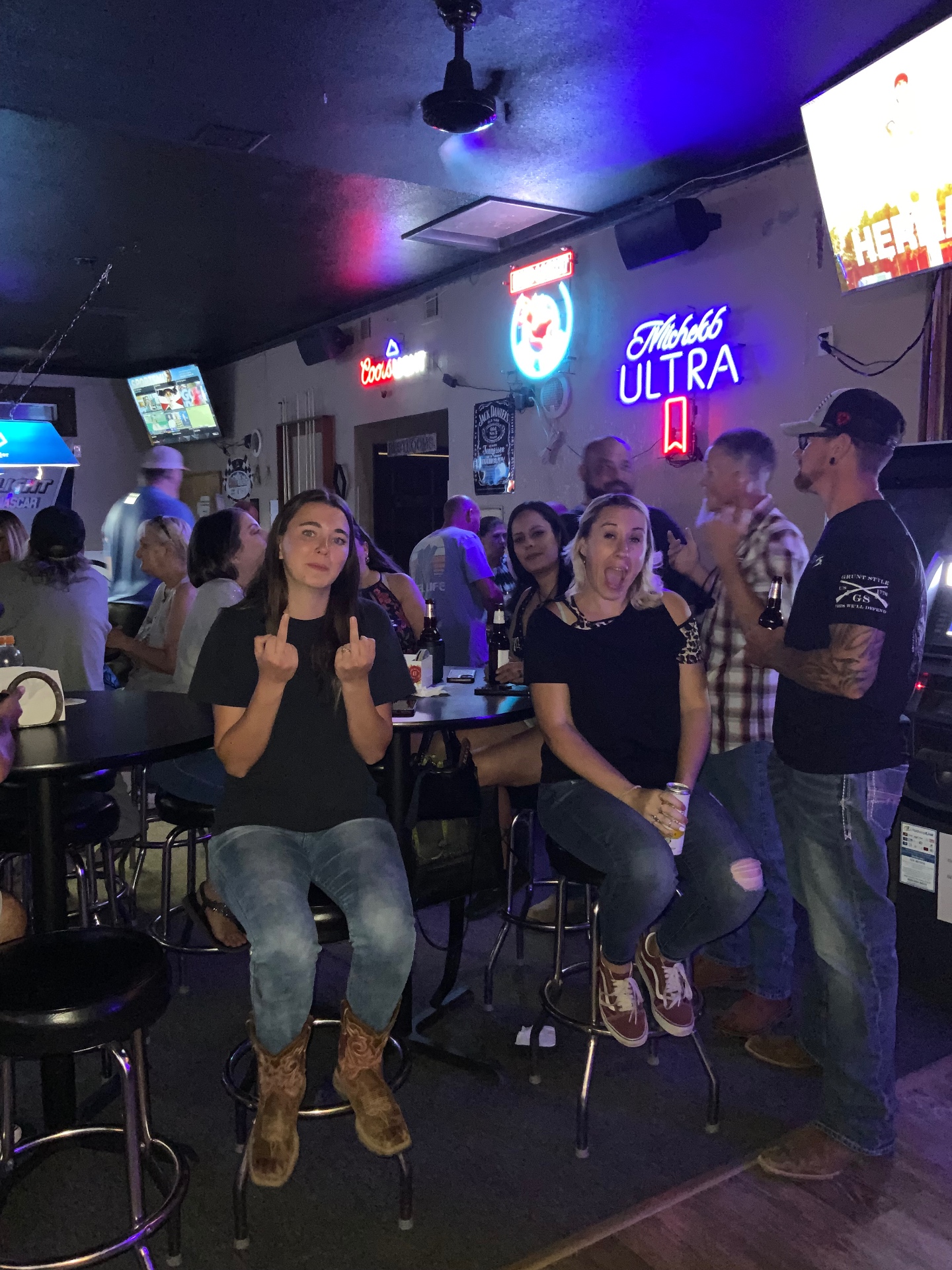 Friends having fun at a Leather & Lace karaoke event