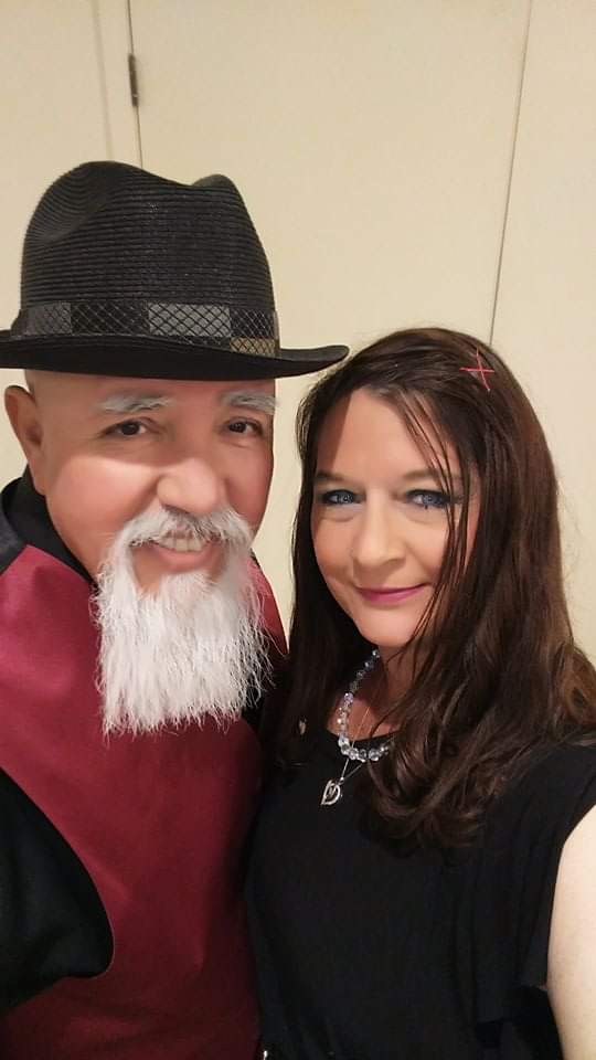 Raul in a black fedora with Laurie before an evening show