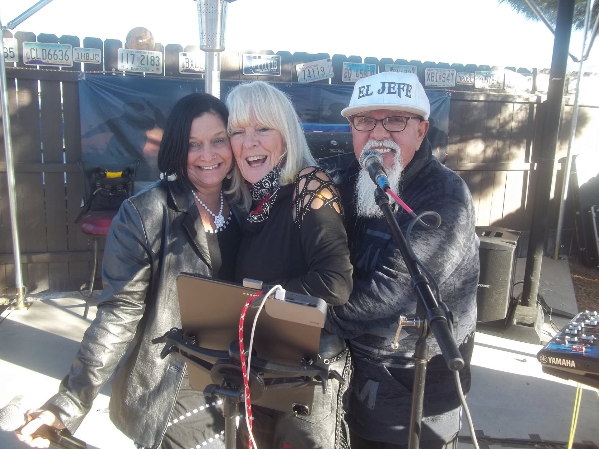 Raul and guests smiling together at the microphone after a show