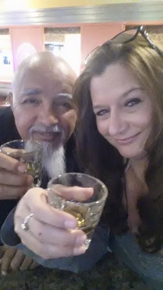 Laurie and Raul toasting drinks at a Las Vegas bar